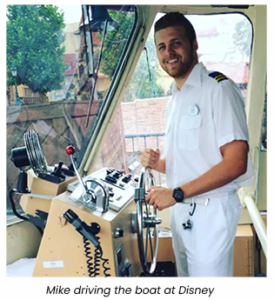 Mike driving the boat at Disney